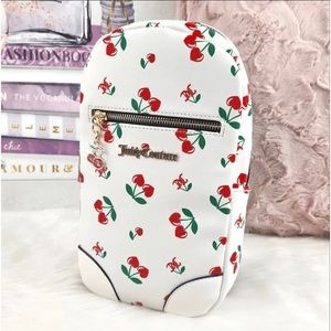 Juicy couture sling bag w cheery and logo and charm .